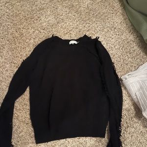 Black sweater with ruffles down the sleeve